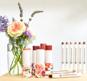 vase of fresh flowers with MultiStick and Instant Shadow Stik cosmetics